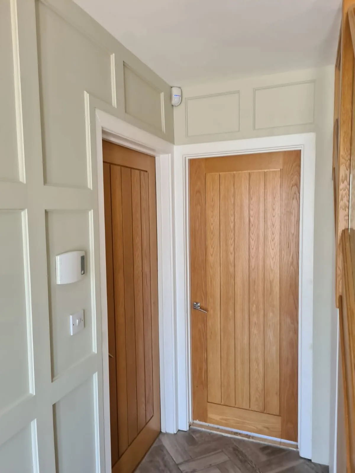 Wood panelled feature wall in a Gloucestershire home
